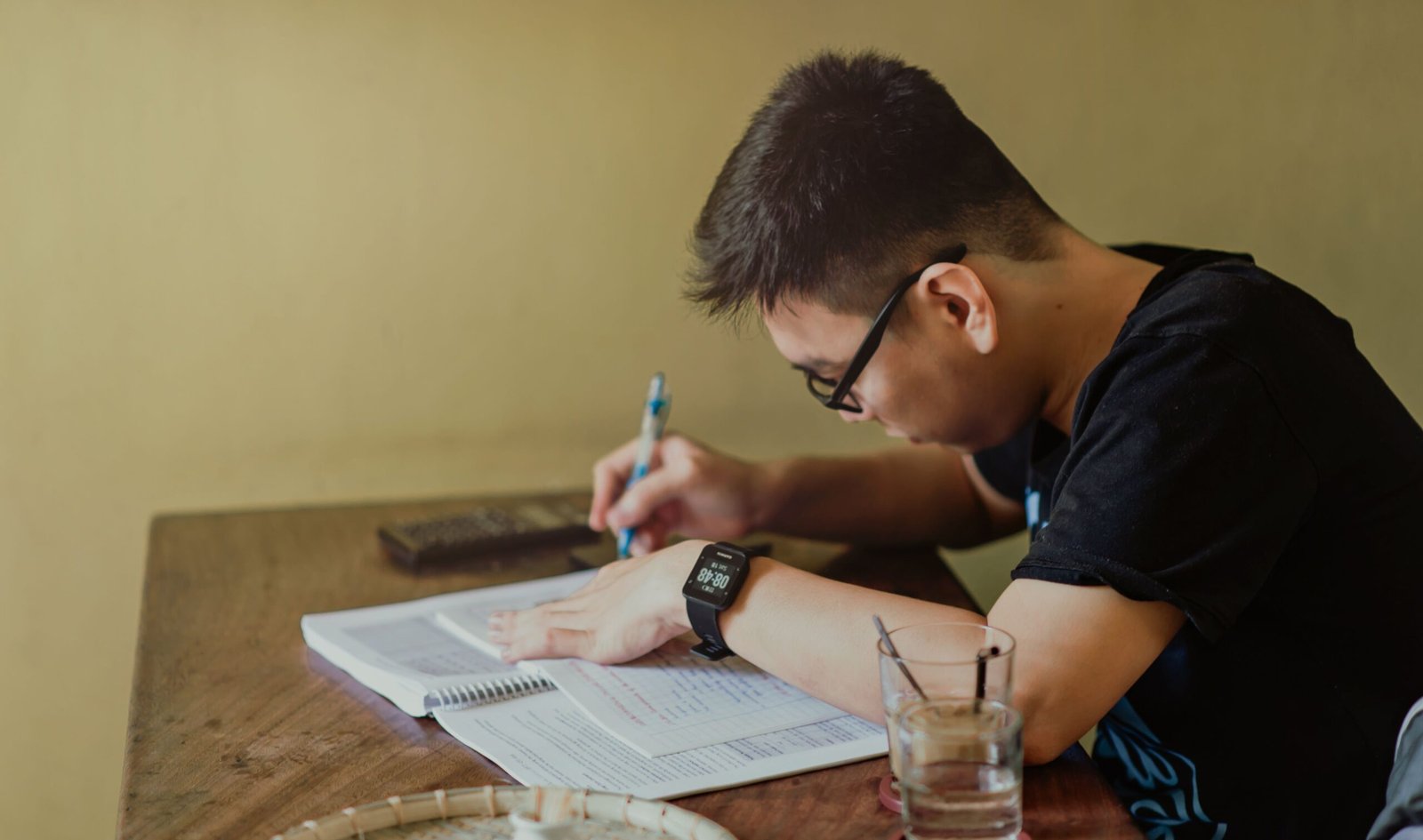 Focused student studying with notes
