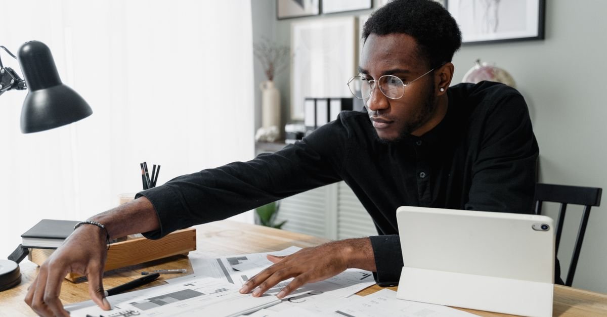 Professional reviewing financial documents, representing audit testing procedures
