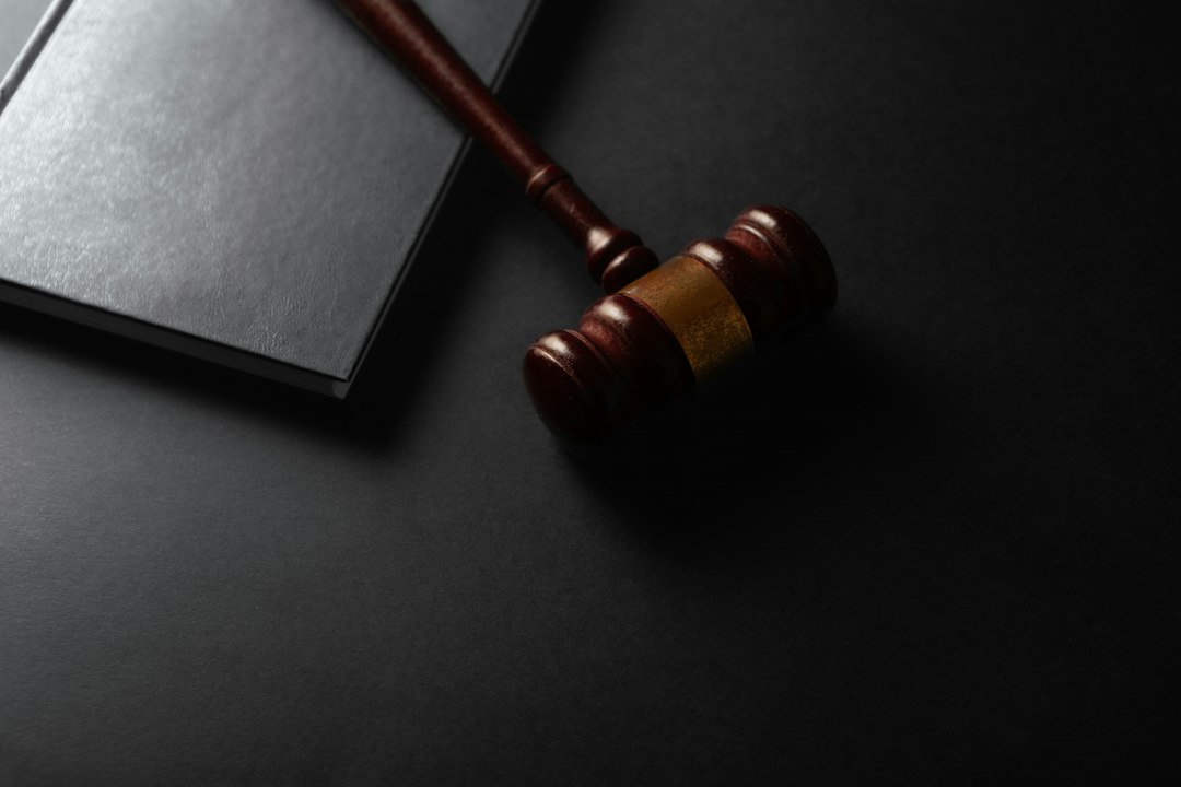 Judge's gavel and law book, illustrating judicial precedent and anti-money laundering law under ICAG Business & Corporate Law
