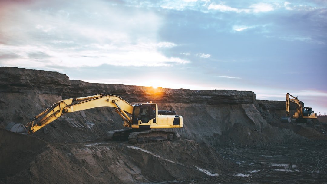 Excavator at a mining site, illustrating mining royalty taxation under ICAG Advanced Taxation