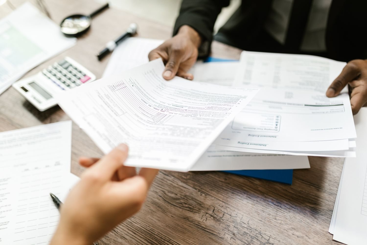 Tax and contract documents symbolizing trading in Ghana versus trading with Ghana taxation rules